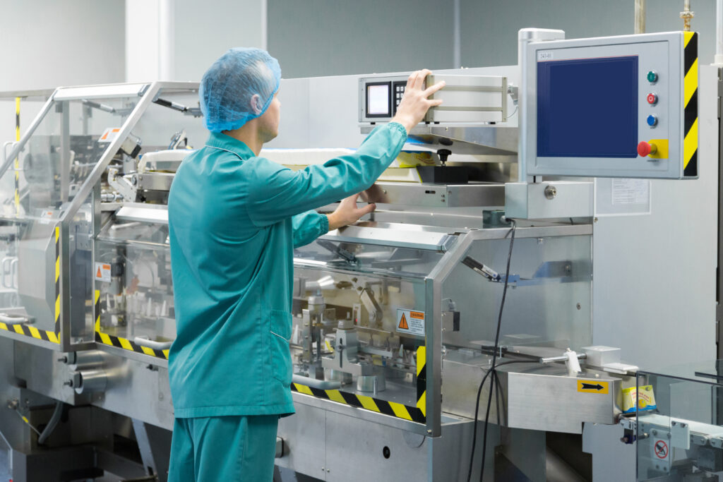 pharmaceutical-factory-man-worker-protective-clothing-operating-production-line-sterile-environment-1024x683